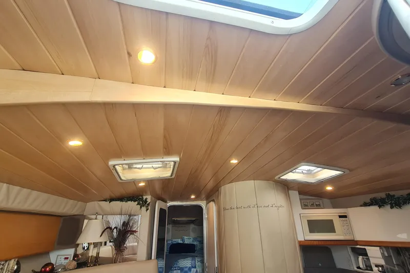 Slide: The Image of Interior of 1998 Formula 41 Performance Cruiser with wooden ceiling and modern amenities. - 17