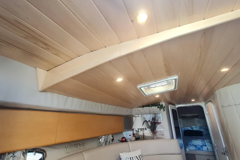 Slide: The Image of Interior of 1998 Formula 41 Performance Cruiser with wood ceiling and cozy decor. - 18