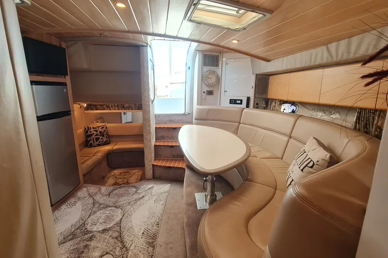 Slide: The Image of Luxurious interior of a 1998 Formula 41 Performance Cruiser with plush seating and modern amenities. - 27