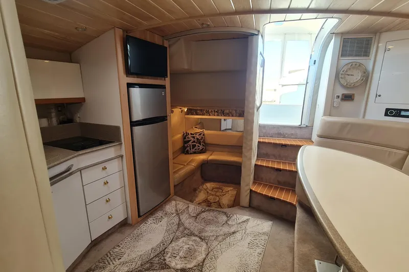 Slide: The Image of Interior of 1998 Formula 41 Performance Cruiser with kitchenette and seating area. - 28