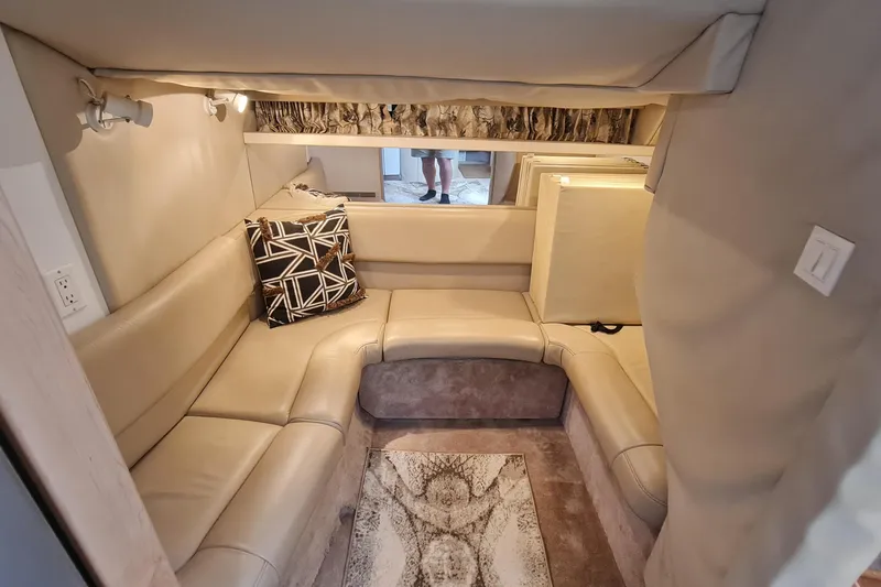 Slide: The Image of 1998 Formula 41 Performance Cruiser interior with beige seating and decorative pillow. - 30