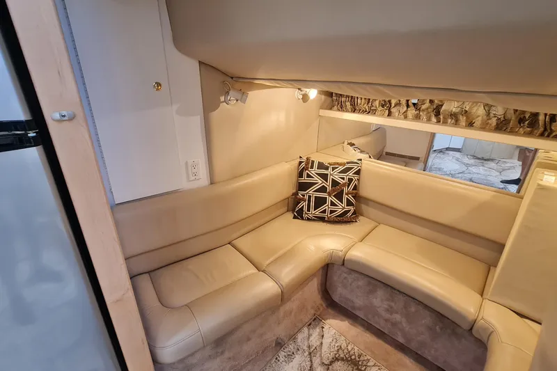 Slide: The Image of Interior of 1998 Formula 41 Performance Cruiser with beige leather seating and geometric pillow. - 32