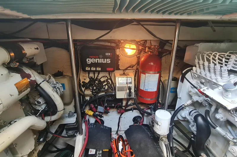 Slide: The Image of Engine room of a 1998 Formula 41 Performance Cruiser with NOCO Genius charger. - 35