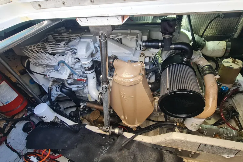 Slide: The Image of Engine compartment of a 1998 Formula 41 Performance Cruiser boat, showcasing mechanical components. - 36