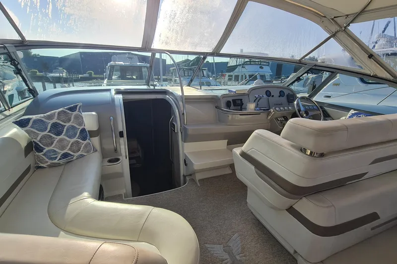 Slide: The Image of 1998 Formula 41 Performance Cruiser interior with plush seating and modern dashboard. - 4