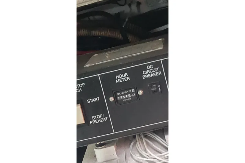 Slide: The Image of Control panel of a 1998 Formula 41 Performance Cruiser with hour meter and DC circuit breaker. - 40