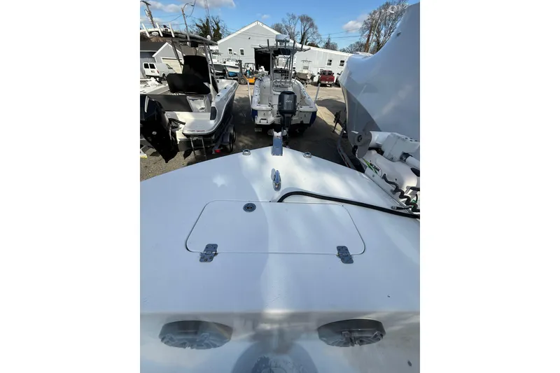 Slide: The Image of 2012 Tidewater 250 CC Adventure boat deck view at a marina. - 15