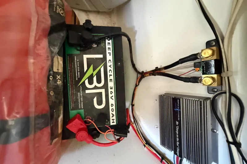 Slide: The Image of 2012 Tidewater 250 CC Adventure boat battery setup with deep cycle 36V 60Ah lithium battery. - 19