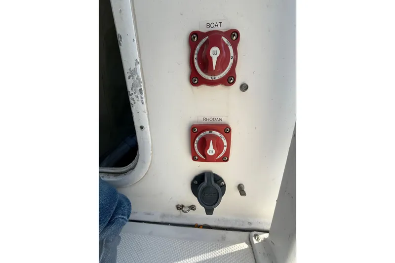 Slide: The Image of Control panel on a 2012 Tidewater 250 CC Adventure boat with labeled switches. - 20