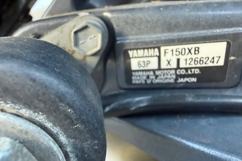 Slide: The Image of Close-up of Yamaha F150XB engine label on 2012 Tidewater 250 CC Adventure boat. - 26