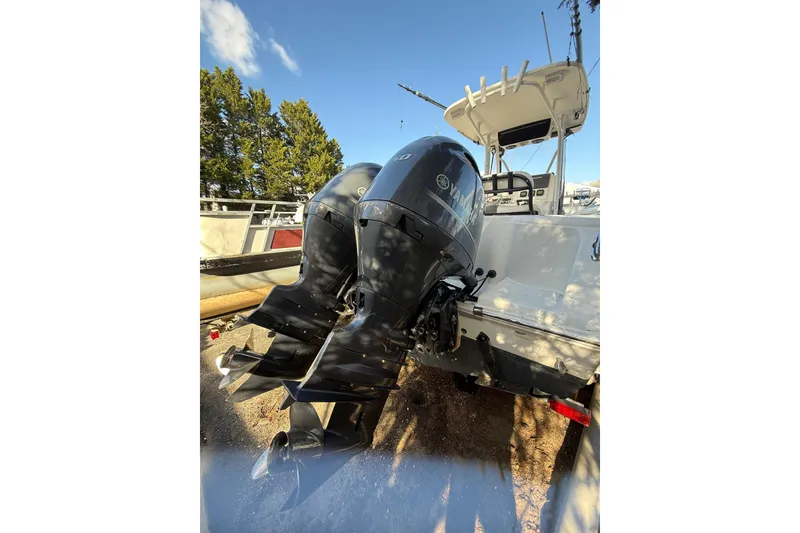 Slide: The Image of 2012 Tidewater 250 CC Adventure boat with dual Yamaha outboard engines. - 7