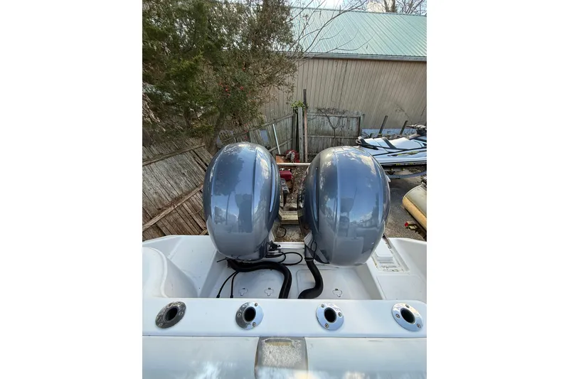 Slide: The Image of Twin outboard motors on a 2012 Tidewater 250 CC Adventure boat. - 9