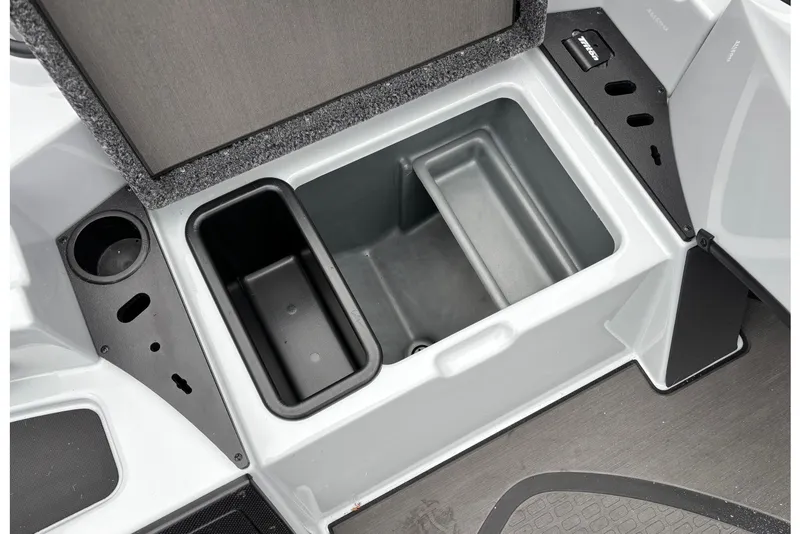 Slide: The Image of 2026 Triton 20XP Patriot boat storage compartment with cup holder and organizer. - 10