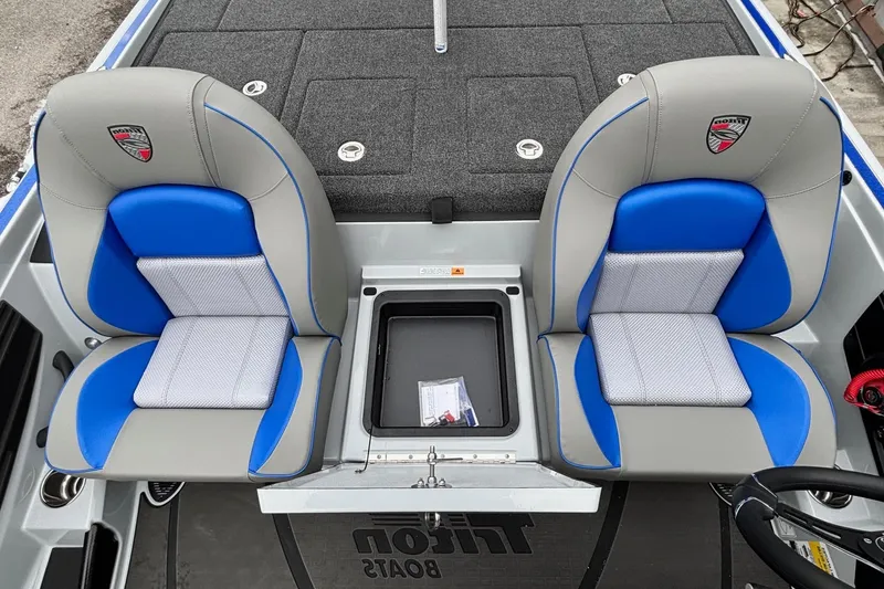 Slide: The Image of Interior of 2026 Triton 20XP Patriot with blue seats. - 13