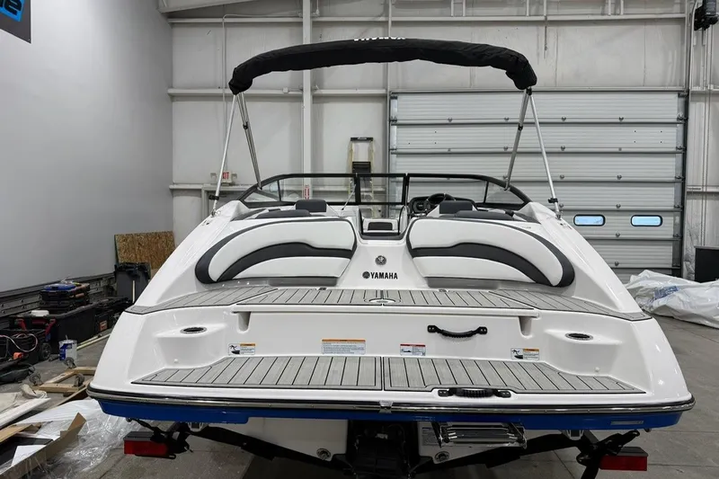 Slide: The Image of 2025 Yamaha Boats SX195 in a garage, showcasing sleek design and modern features. - 2