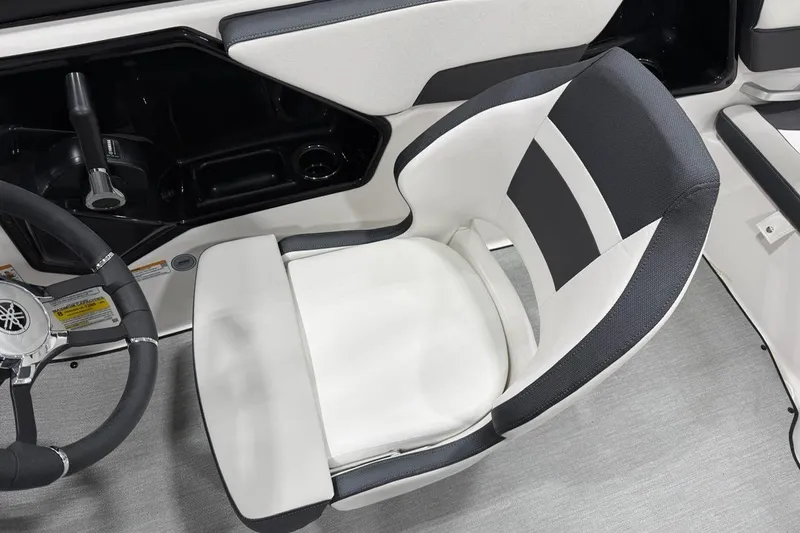 Slide: The Image of 2025 Yamaha Boats SX195 cockpit with steering wheel and comfortable seating. - 4