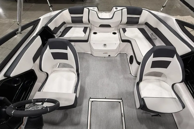 Slide: The Image of 2025 Yamaha Boats SX195 interior with modern seating and steering wheel. - 6