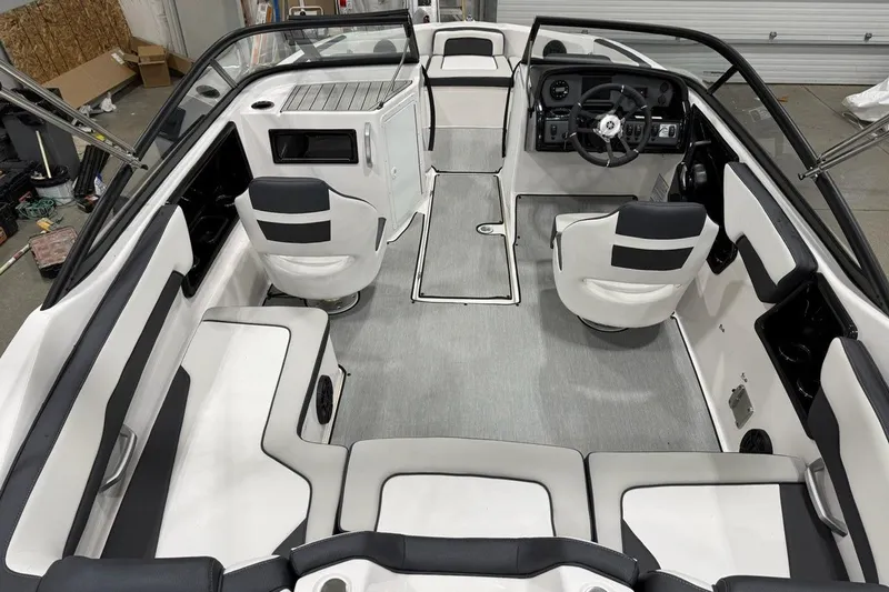 Slide: The Image of 2025 Yamaha Boats SX195 interior with sleek seating and modern dashboard design. - 8
