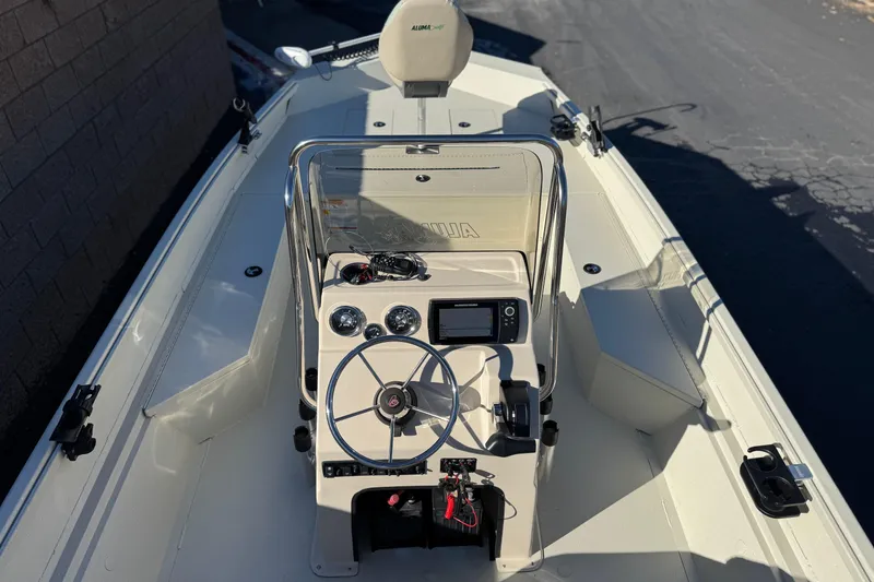 Slide: The Image of 2020 Alumacraft 2072 Bay boat interior with steering console and navigation equipment. - 12