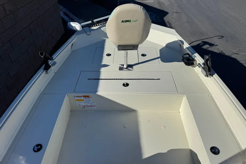 Slide: The Image of 2020 Alumacraft 2072 Bay boat interior with seating and storage compartments. - 13