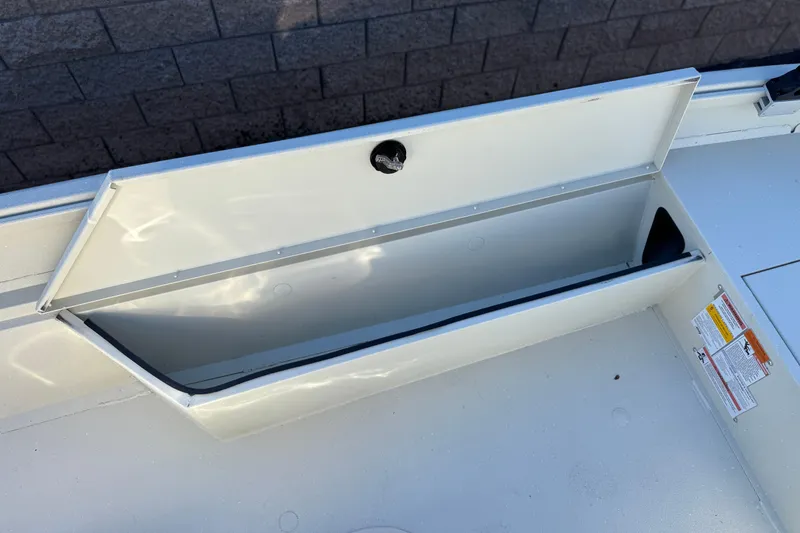 Slide: The Image of Open storage compartment on a 2020 Alumacraft 2072 Bay boat. - 16