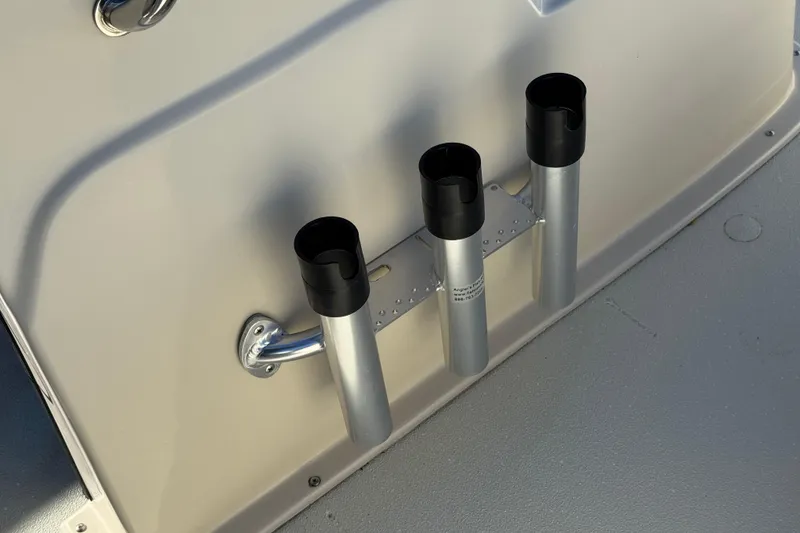 Slide: The Image of 2020 Alumacraft 2072 Bay boat rod holders on deck, featuring three silver tubes. - 20