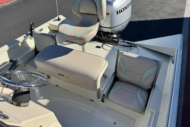 Slide: The Image of 2020 Alumacraft 2072 Bay boat interior with Honda motor and seating arrangement. - 21