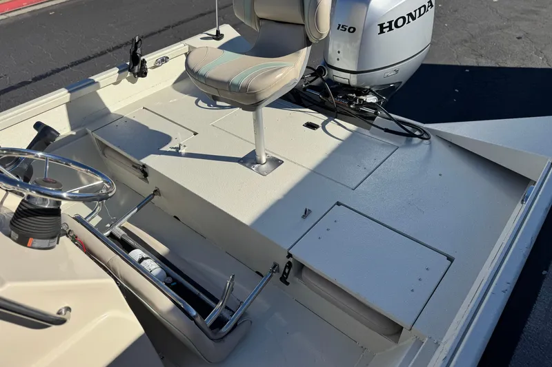 Slide: The Image of 2020 Alumacraft 2072 Bay boat interior with Honda 150 outboard motor. - 22