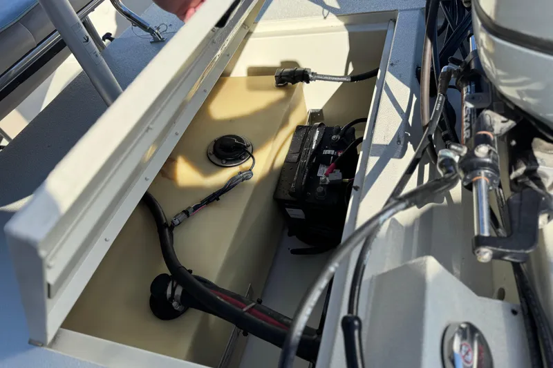 Slide: The Image of 2020 Alumacraft 2072 Bay boat battery compartment with wiring and components. - 23