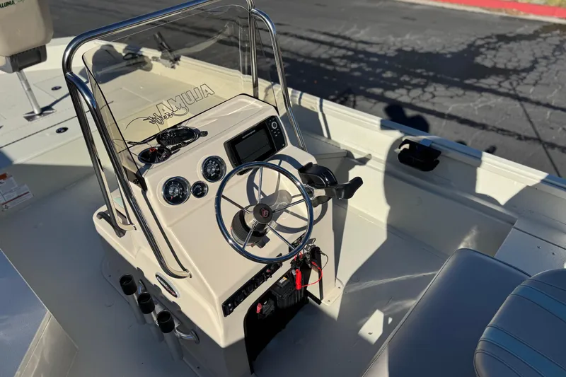 Slide: The Image of 2020 Alumacraft 2072 Bay boat console with steering wheel and gauges. - 24