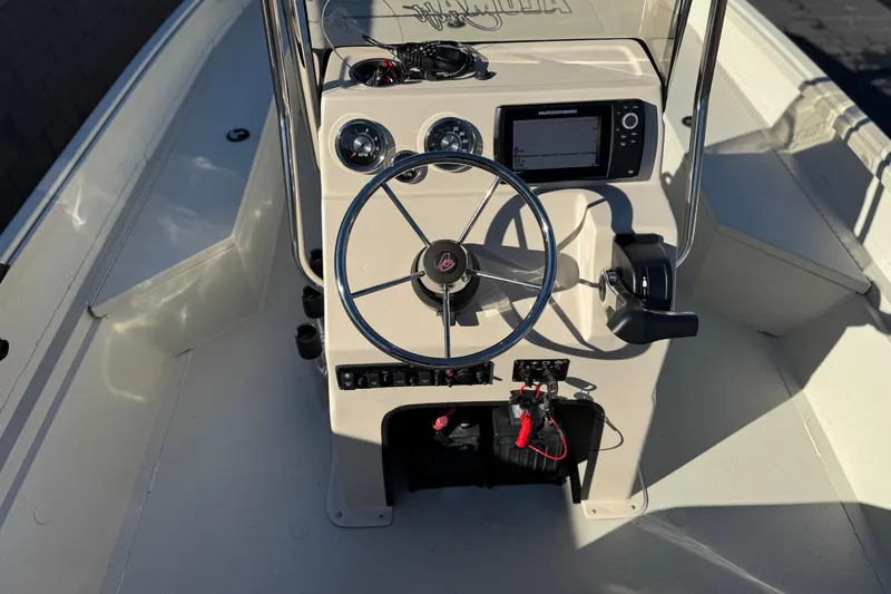 Slide: The Image of 2020 Alumacraft 2072 Bay boat console with steering wheel and navigation controls. - 25