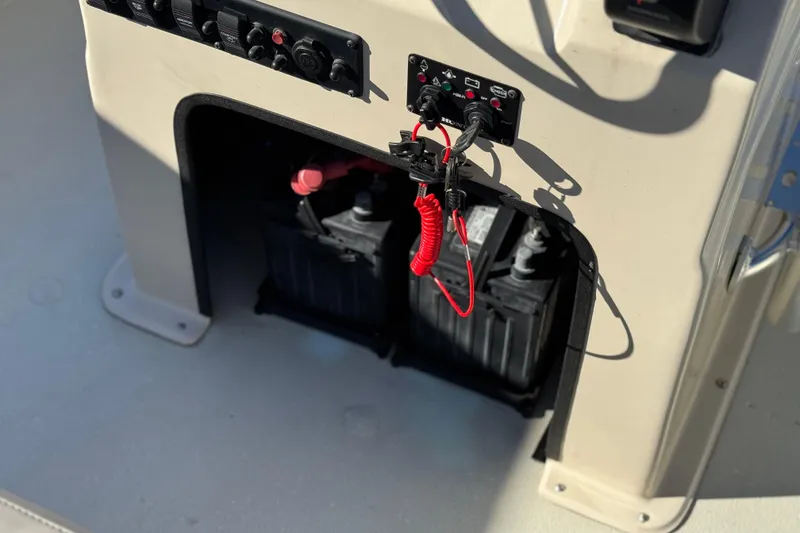 Slide: The Image of 2020 Alumacraft 2072 Bay boat battery compartment with control panel and wiring. - 27