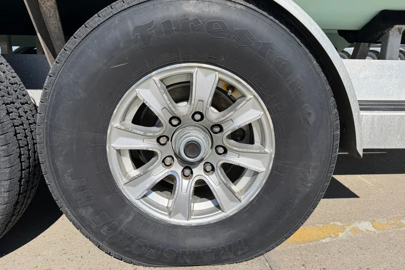 Slide: The Image of Close-up of a Firestone tire on a Freeman 33 trailer, 2013 model. - 101