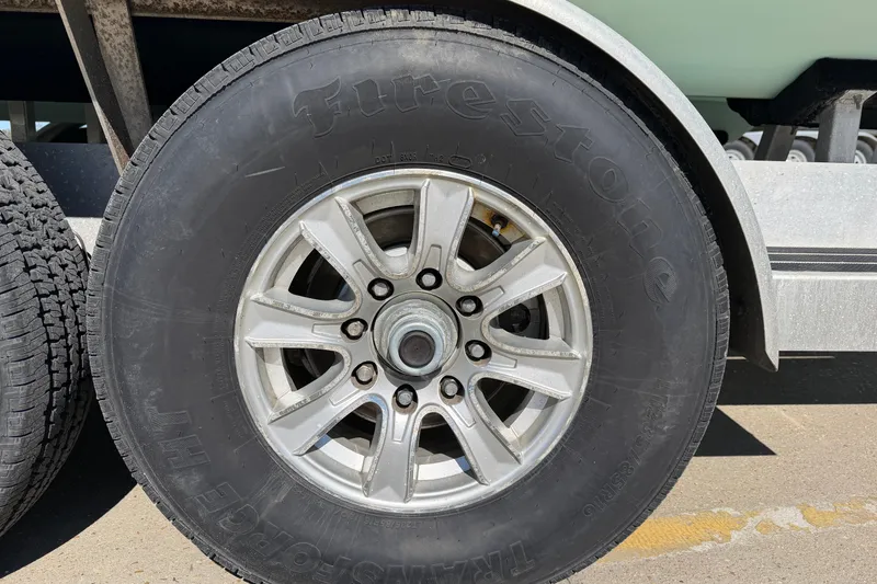 Slide: The Image of Close-up of a Firestone tire on a Freeman 33 trailer, 2013 model. - 102