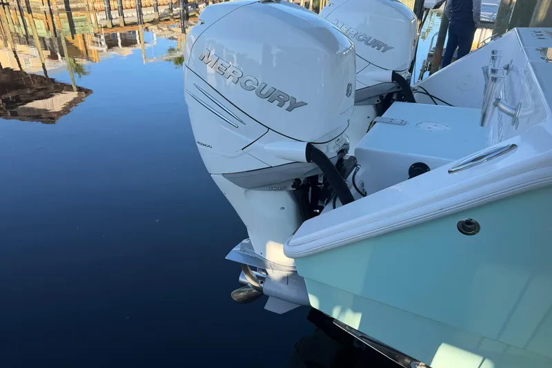 Slide: The Image of Freeman 33 boat's helm with teal hardtop and stainless steel supports, 2013 model. - 13