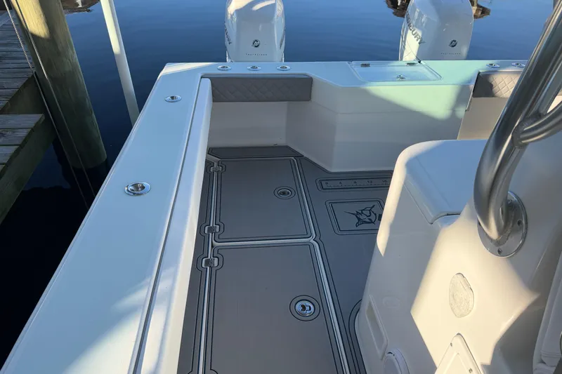 Slide: The Image of Freeman 33 boat, 2013 model, featuring a sleek T-top and modern design elements. - 14