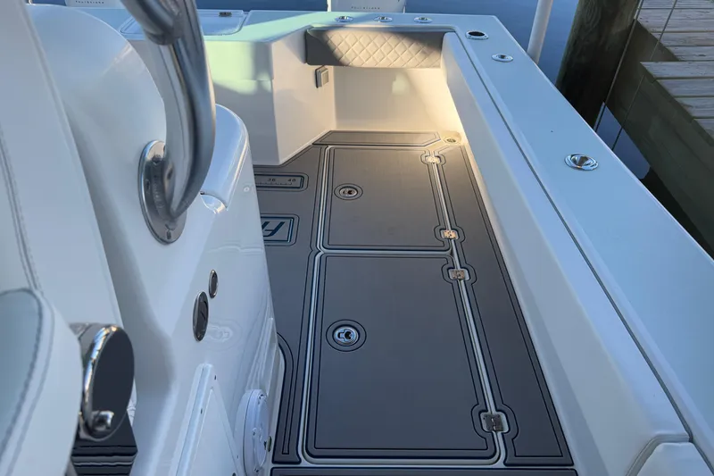 Slide: The Image of Freeman 33 boat, 2013 model, featuring a sleek T-top and Simrad electronics. - 15