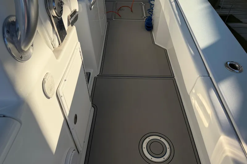 Slide: The Image of 2013 Freeman 33 boat deck with dual engines and sleek design. - 17