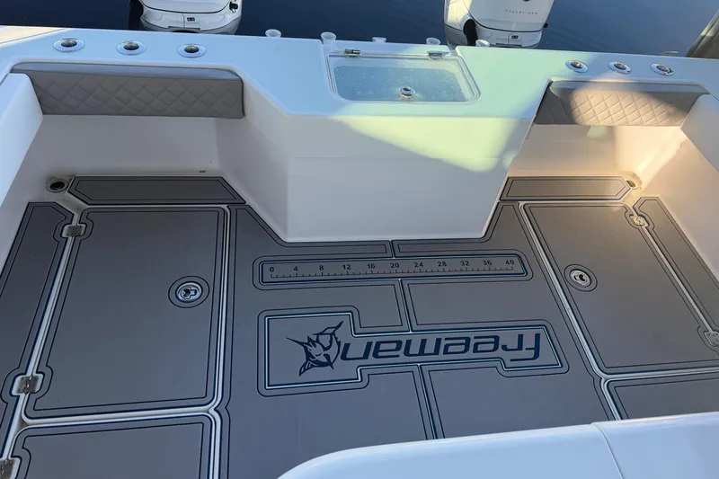 Slide: The Image of Reflection of boats on a Freeman 33, 2013 model, with a glossy finish. - 2