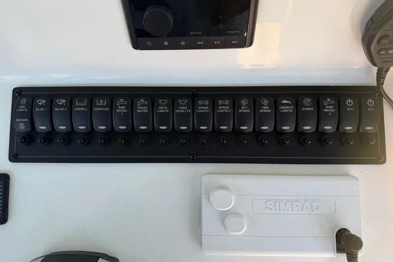 Slide: The Image of Luxurious seating on a 2013 Freeman 33 boat, featuring quilted upholstery and armrests. - 22