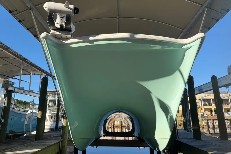 Slide: The Image of 2013 Freeman 33 boat docked under a canopy, side view. - 3