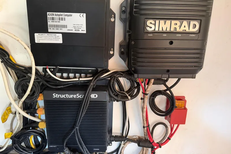 Slide: The Image of Electrical system and wiring inside a 2013 Freeman 33 boat, featuring batteries and cables. - 30