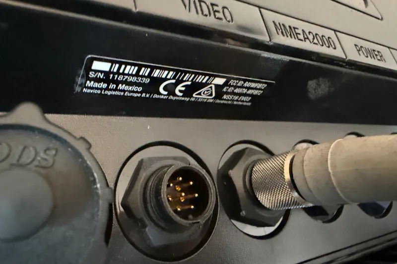 Slide: The Image of Power inverter setup in a Freeman 33, 2013 model, with visible wiring and components. - 31