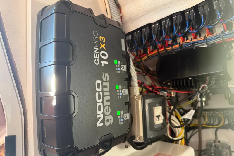 Slide: The Image of Simrad marine electronics panel with various cable connections on a Freeman 33, 2013 model. - 35