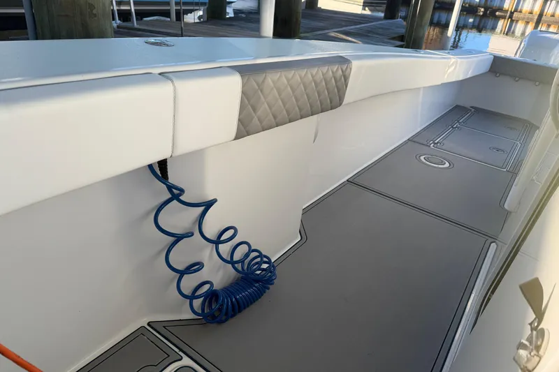 Slide: The Image of Open storage compartment on a 2013 Freeman 33 boat, showing interior details. - 46