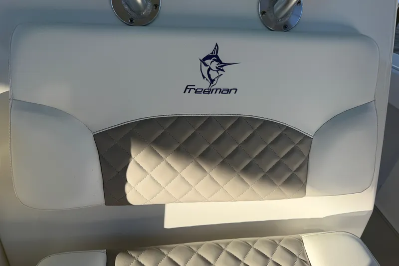 Slide: The Image of Interior detail of a 2013 Freeman 33 boat, featuring a corner with an orange cable. - 48