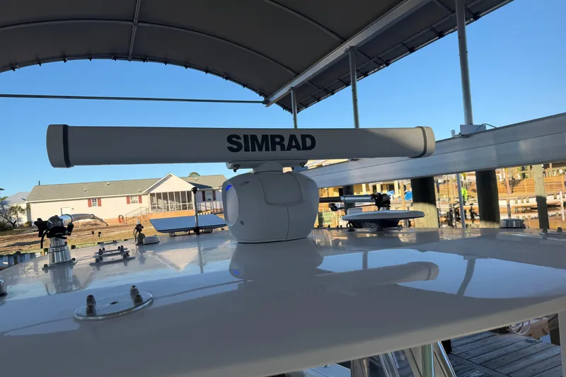 Slide: The Image of Freeman 33 boat interior, 2013 model, featuring a coiled blue hose on deck. - 50