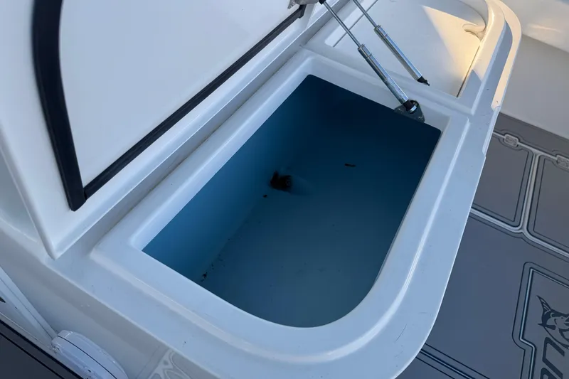 Slide: The Image of Simrad radar on Freeman 33 boat, 2013 model, under a canopy at a dock. - 53