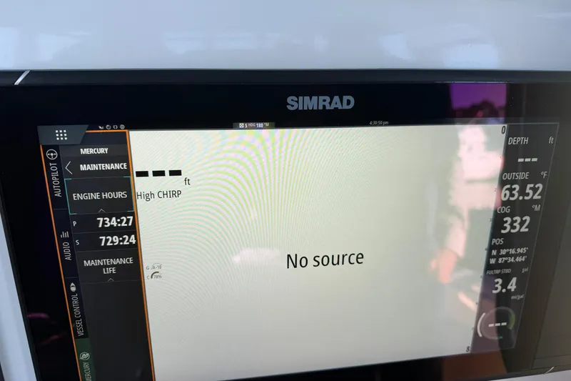 Slide: The Image of Open storage compartments on a 2013 Freeman 33 boat, featuring dual lids and hydraulic supports. - 55