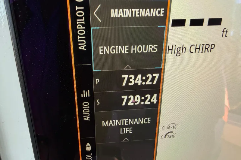 Slide: The Image of Open storage compartment on a 2013 Freeman 33 boat, featuring hydraulic hinges. - 56